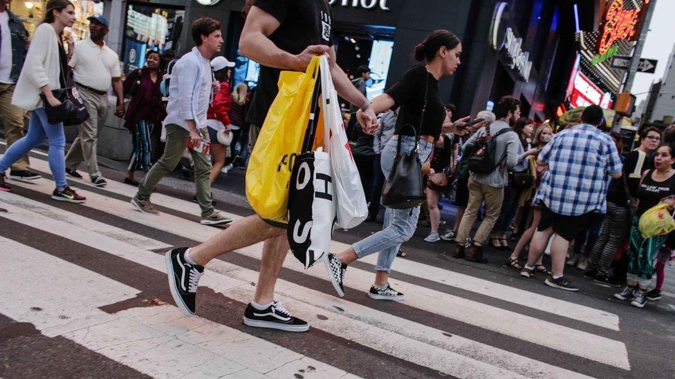 man-holding-plastic-bags.