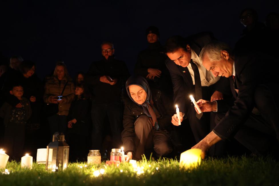 People light candles in memory of MP Sir David Amess