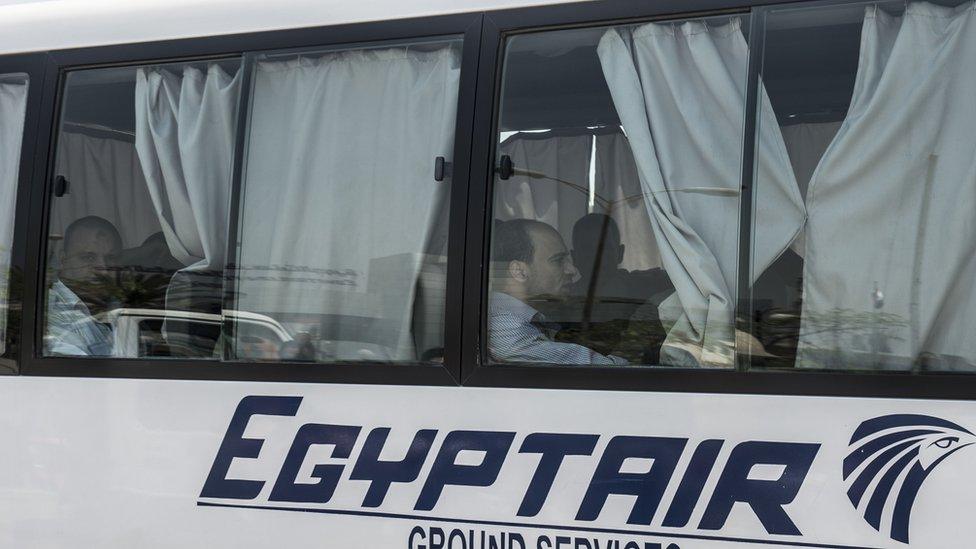 Family members of passengers who were flying aboard an EgyptAir plane that vanished from radar en route from Paris to Cairo overnight are transported by bus to a gathering point at Cairo airport on 19 May 2016.