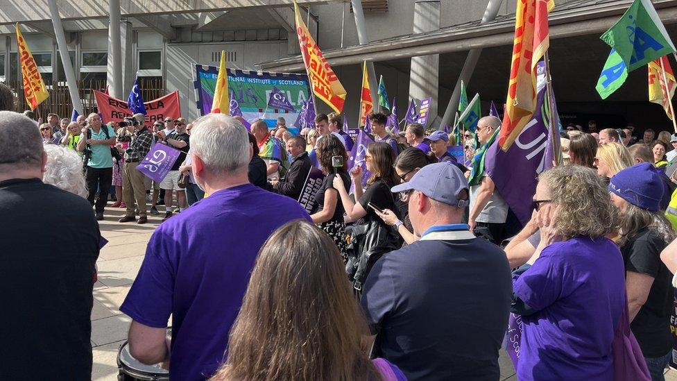 Members of the EIS-Fela union protesting over pay outside the Scottish Parliament