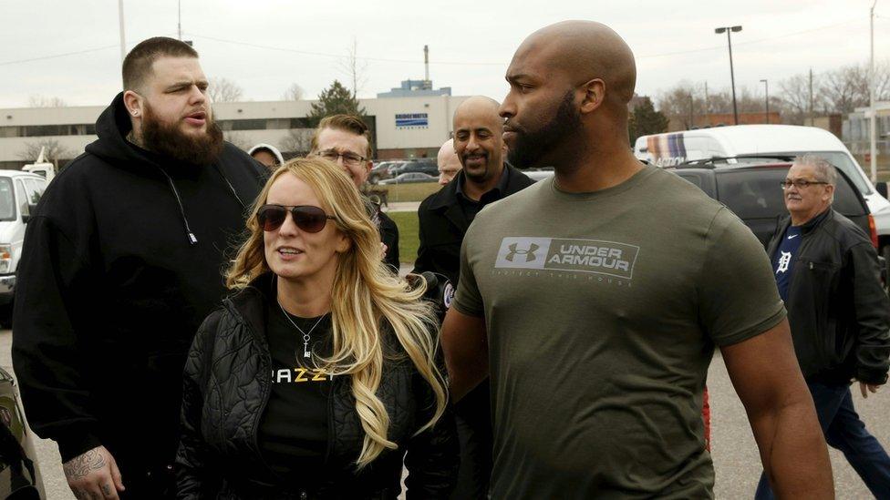 Stormy Daniels with her bodyguards in Detroit, 18 April