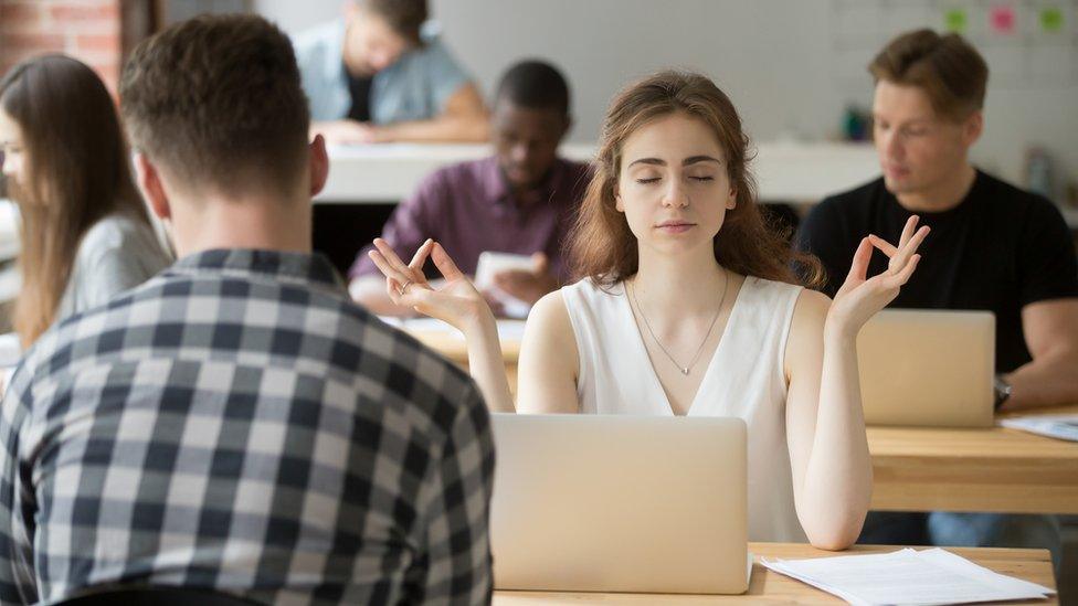 A woman meditating (stock image)