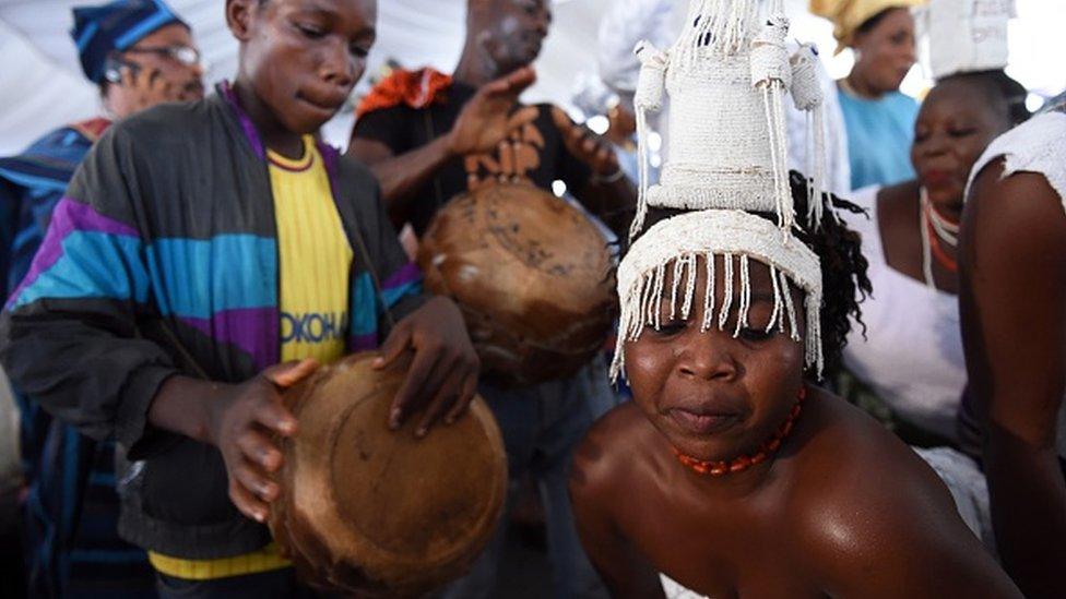 A woman dances during the coronation of the Ooni of Ife, Oba Adeyeye Enitan Ogunwusi at Ile-Ife in southwest Nigeria, on December 7, 2015