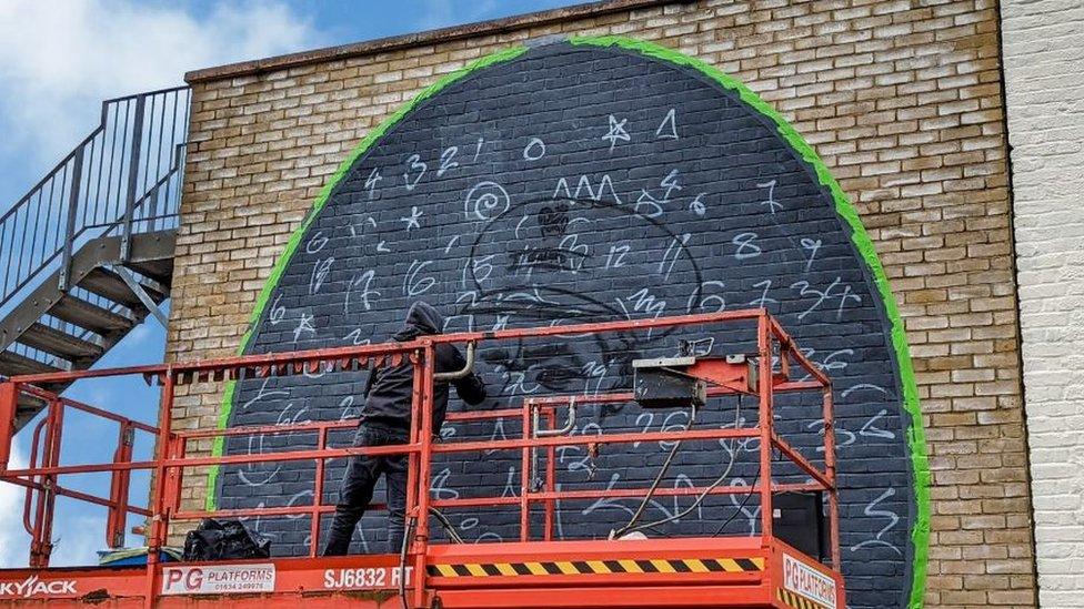 Creation of Asquith Xavier mural by artist Voyder