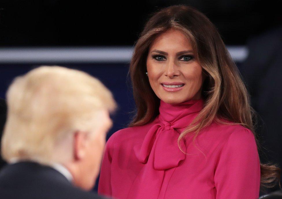 Melania Trump (right) greets her husband after the town hall debate at Washington University on October 9, 2016.