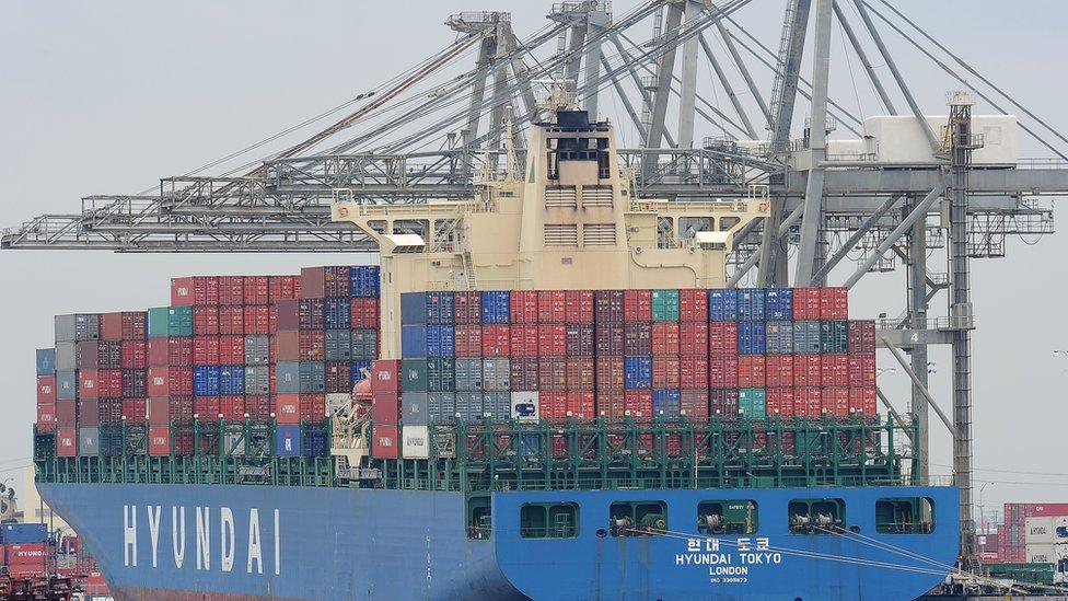 A cargo ship being unloaded off the coast of California