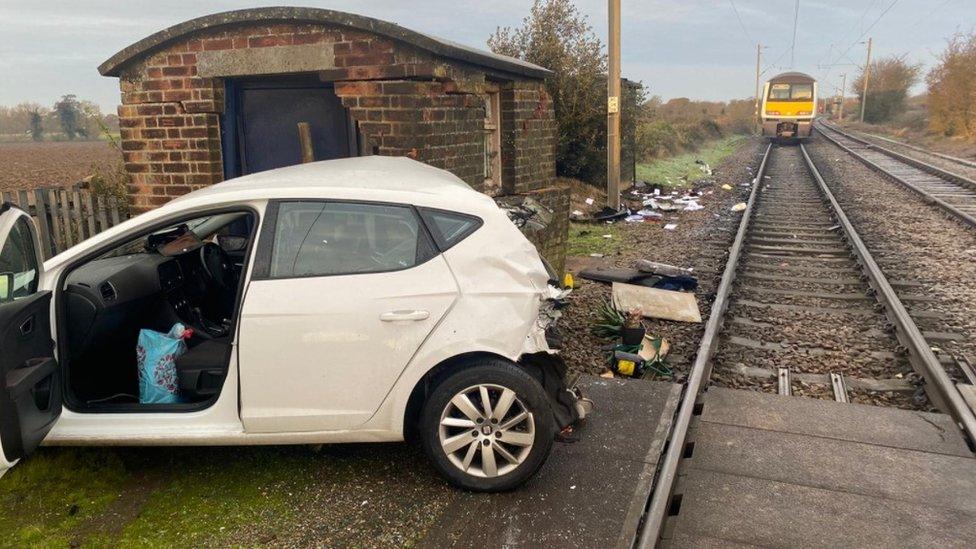 Car hit by train