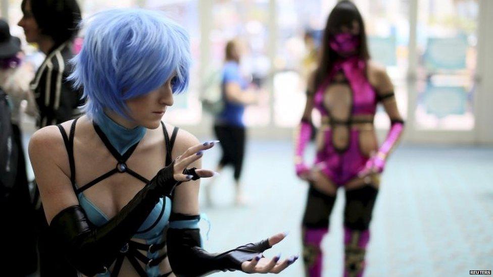 Cosplay attendees pose for pictures at the 2015 Comic-Con International in San Diego, California, 9 July 2015