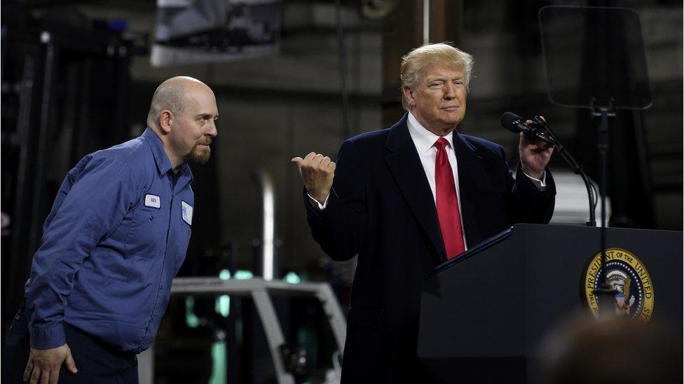 President Donald Trump introduces Ken Wilson, an employee of H&K Equipment, to supporters at a rally at H&K Equipment, a rental and sales company for specialized material handling solutions on January 18, 2018 in Coraopolis, Pennsylvania