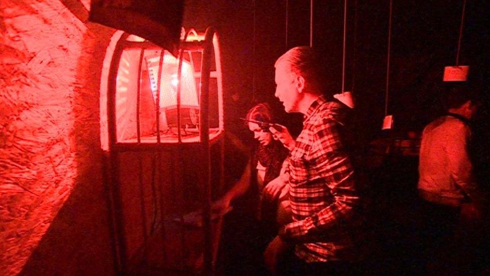 People taking part in an escape game