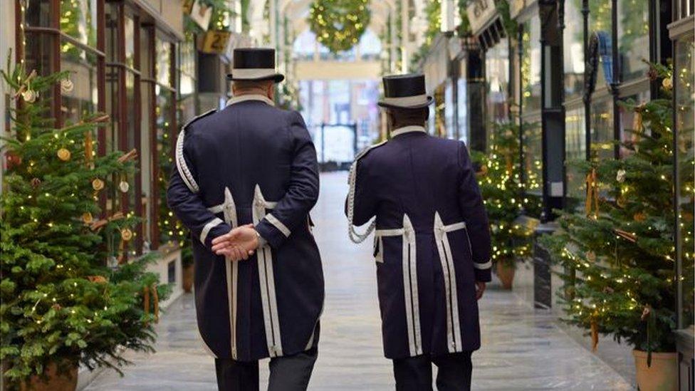 Two Beadles walk through Burlington Arcade