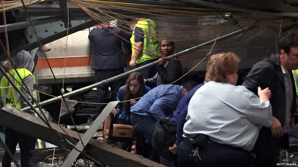 Passengers rush to safety after a train crashed into the platform at the Hoboken Terminal on 29 September 2016.