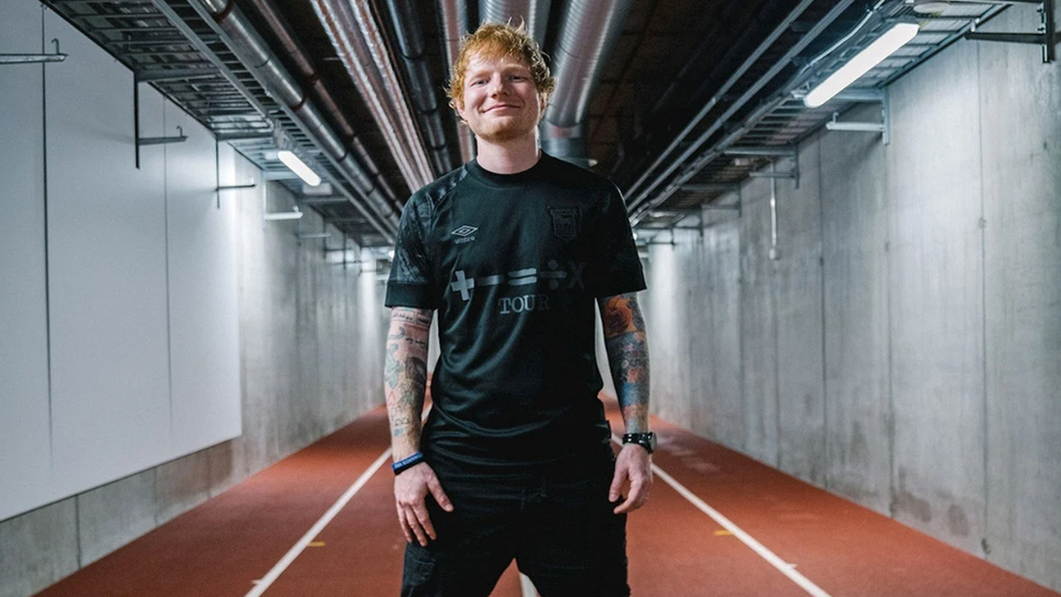 Ed Sheeran in Ipswich Town blackout kit