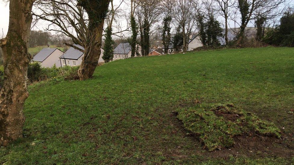 Broken ground at the grave site