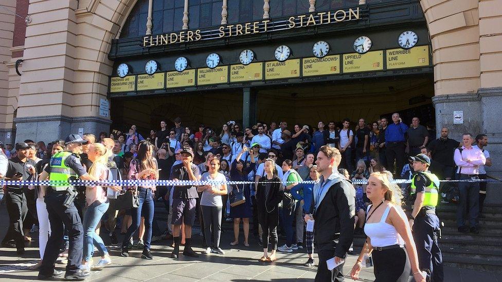 Police have cordoned off the area by Flinders Street station, Melbourne, after a car hit people, 21 December 2017