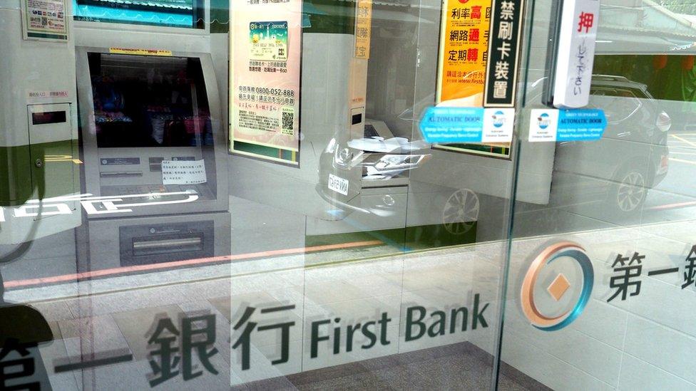 A general view shows temporarily shut down ATM machines in the Mucha branch of the First Bank in Taipei, Taiwan, 12 July 2016.