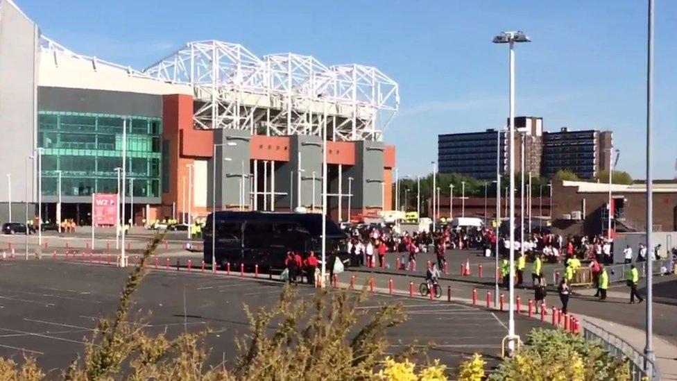 Coach leaving Old Trafford