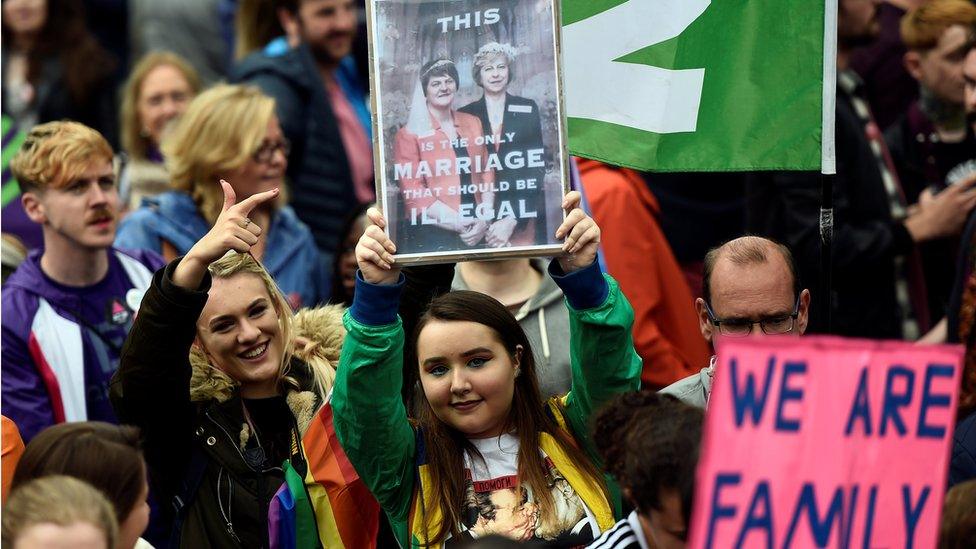 Some demonstrators held placards protesting about the DUP - which opposes same-sex marriage - and its deal with the Conservatives