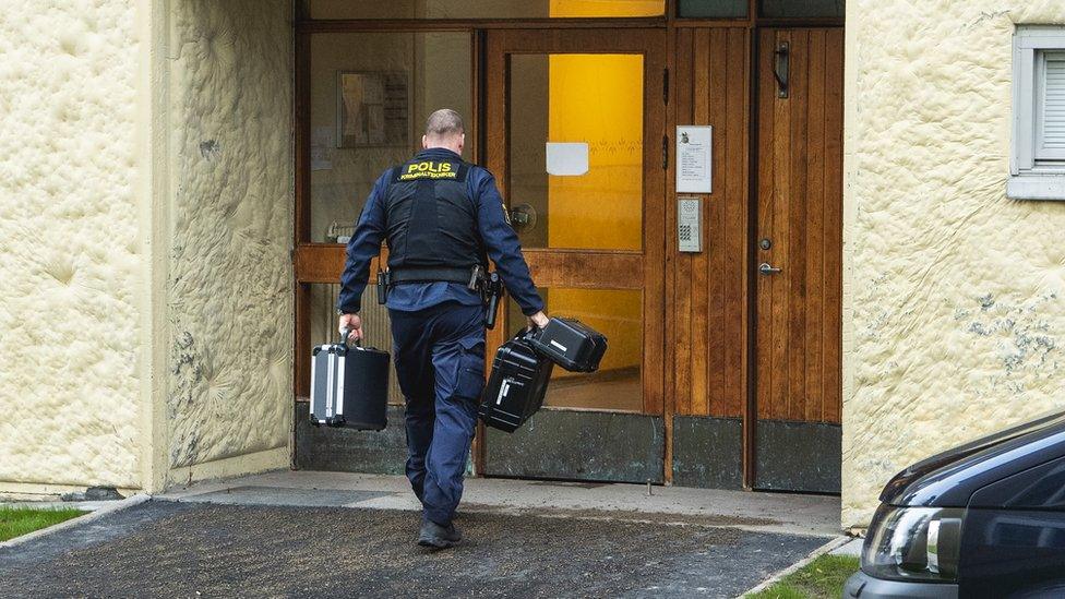 Police outside the apartment building in Haninge, 1 December