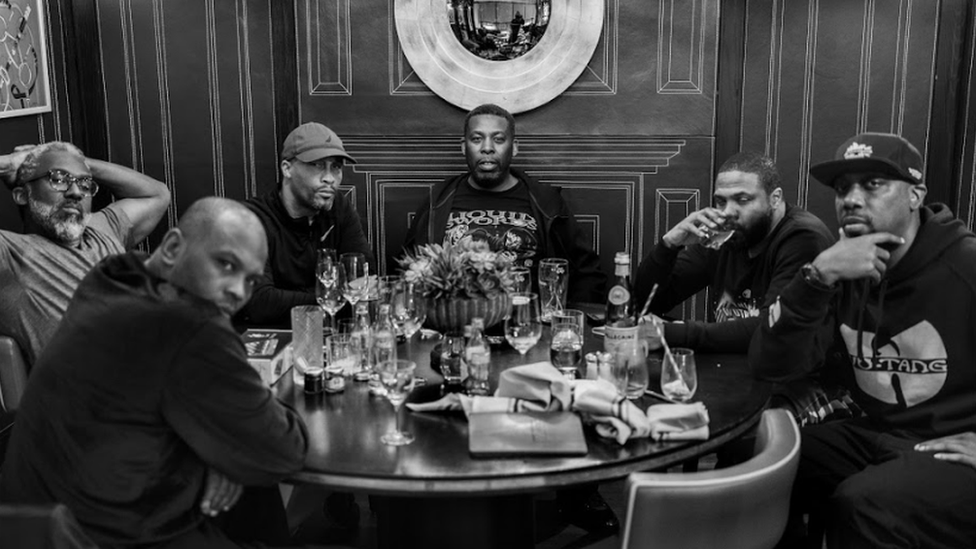 Wu-Tang Clan at a dinner table