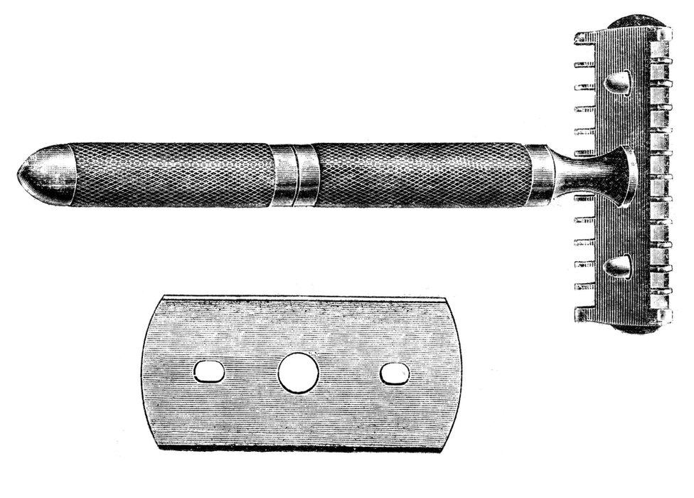 An old fashioned razor and razor blade