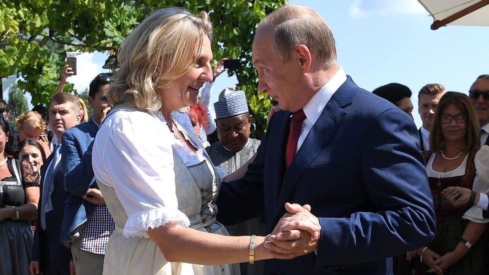 Austria's former foreign minister Karin Kneissl dances with Russia's President Vladimir Putin at her wedding in 2018.