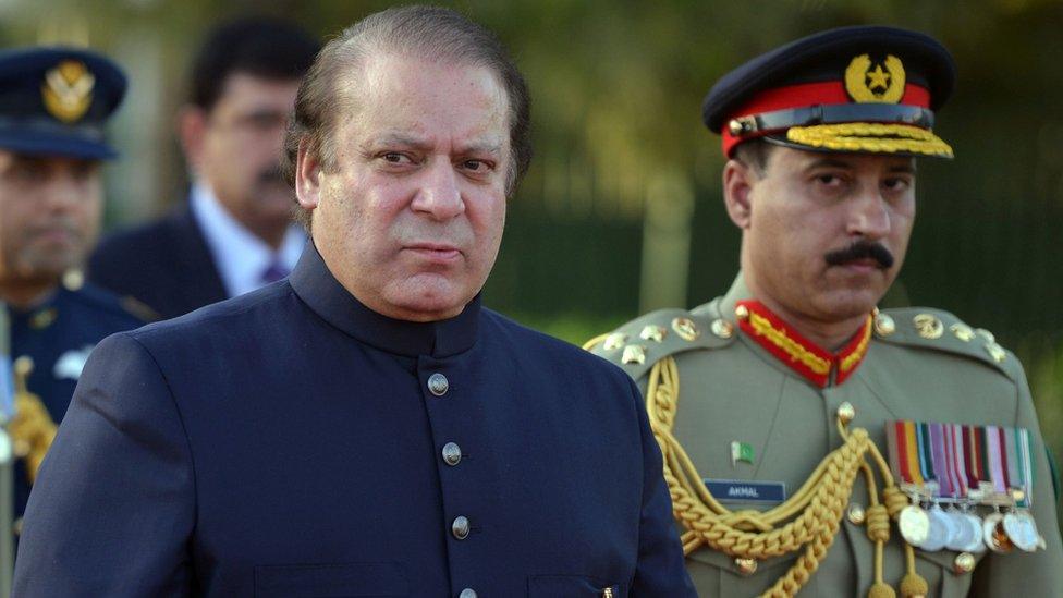 Nawaz Sharif inspects a guard of honour during a welcoming ceremony at the Prime Minister's House in Islamabad, 28 July 2017