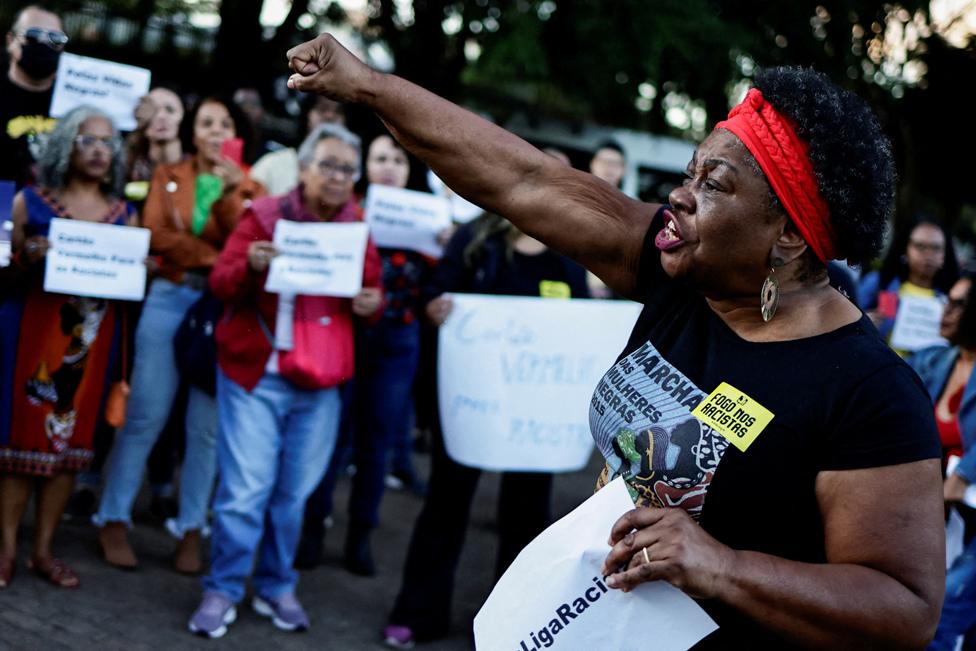 A woman shouts slogans during a protest in solidarity with Real Madrid soccer player Vinicius Jr, who was racially abused during a club match in Spain, in front of the consulate of Spain in Brasilia, Brazil May 25, 2023.