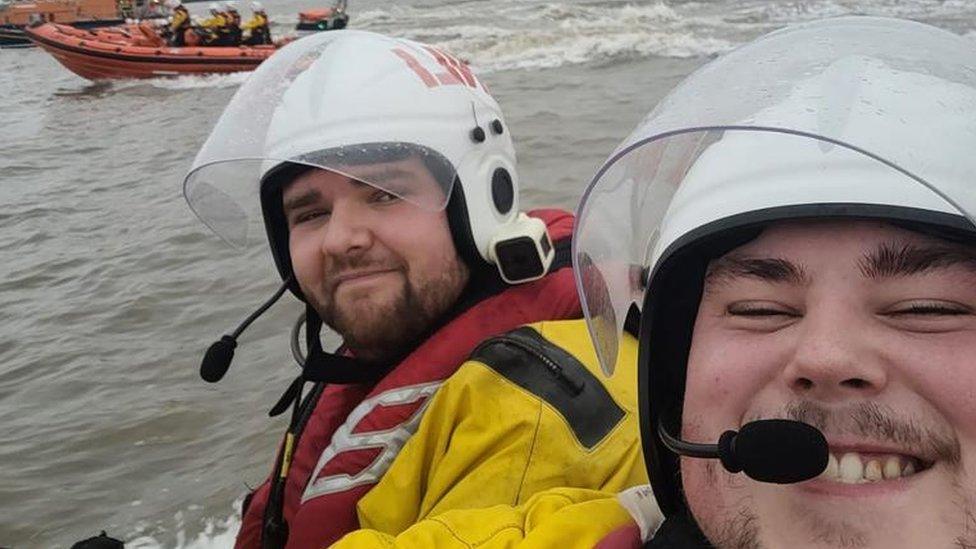 Chris with one of his colleagues on a boat