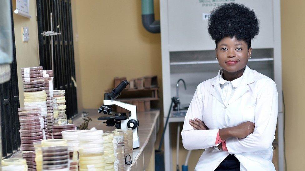 Dr Adenike Akinsemolu in a lab wearing a white lab coat