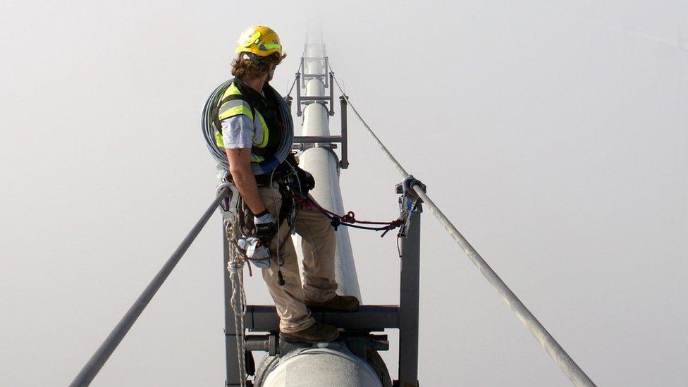 Rope access technician on Forth Road Bridge