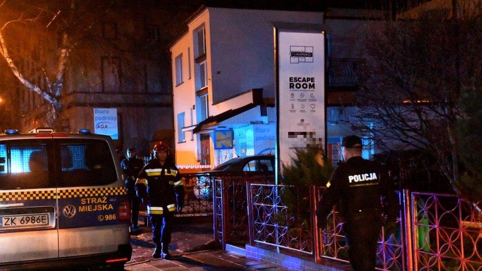 Police secure a scene of a fire in Koszalin, Poland, 4 January 2019