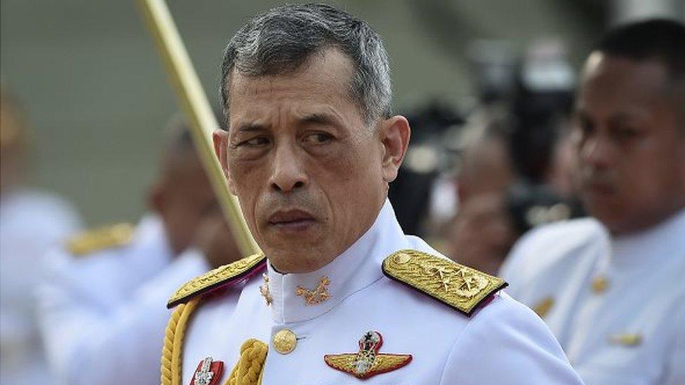 Thailand's King Vajiralongkorn is seen paying respects at the statue of King Rama I after signing the military-backed constitution in Bangkok on April 6, 2017.