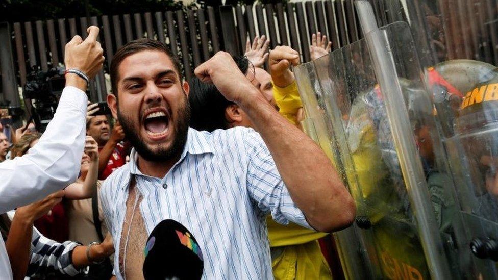 Juan Requesens clashes with Venezuela's National Guard during a protest outside the Supreme Court of Justice (TSJ) in Caracas, Venezuela March 30, 2017