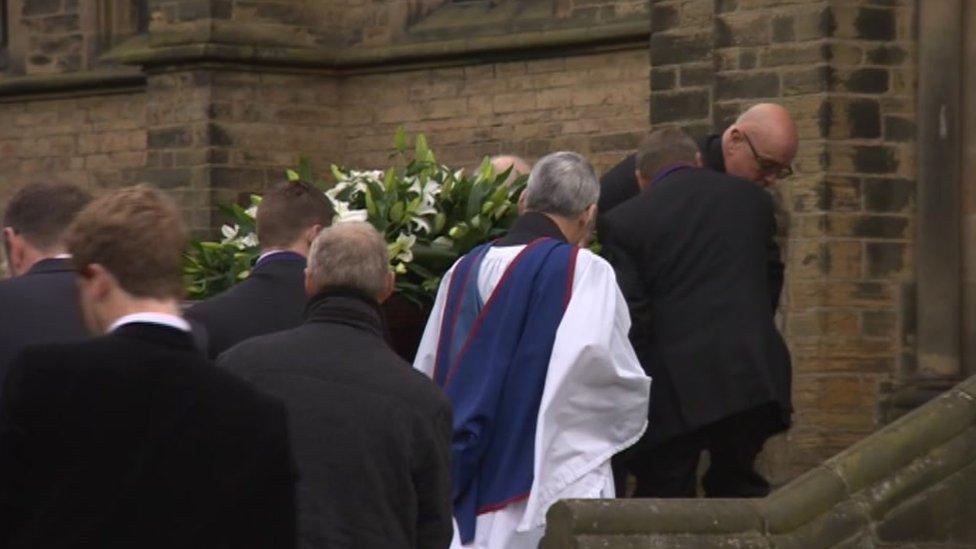 Coffin enters the church