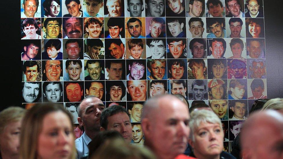 Photographs of the victims are displayed on a wall as family members attend a Hillsborough Justice Campaign Press Conference in 2016