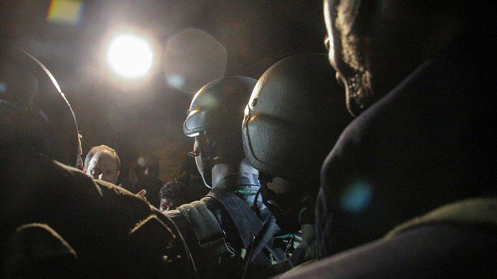 Bangladeshi security personnel stand guard after gunmen stormed Holey Artisan Bakery cafe on July 02, 2016 in Dhaka, Bangladesh.