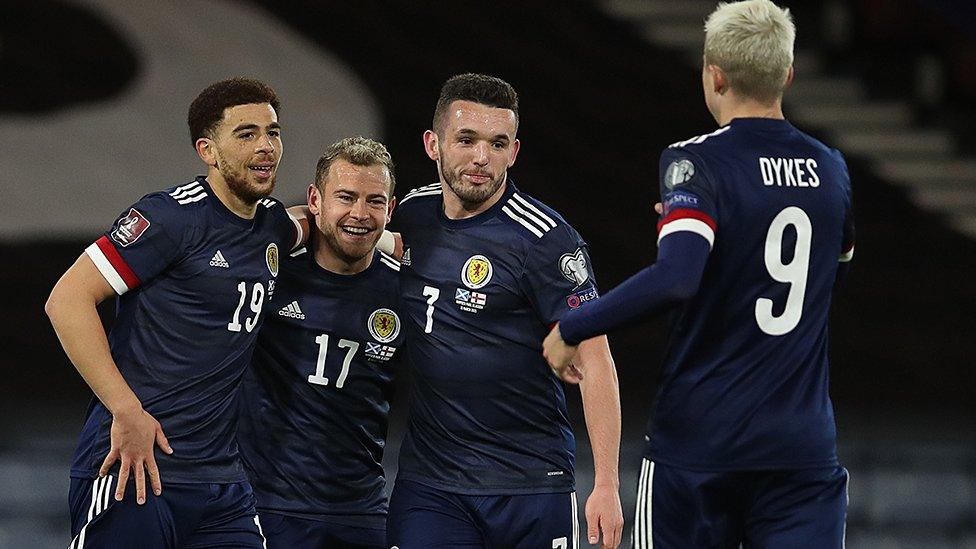 Che Adams celebrates scoring for Scotland