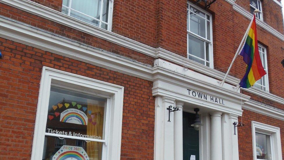 Witham Town Hall flying the LGBTQ+ Pride flag