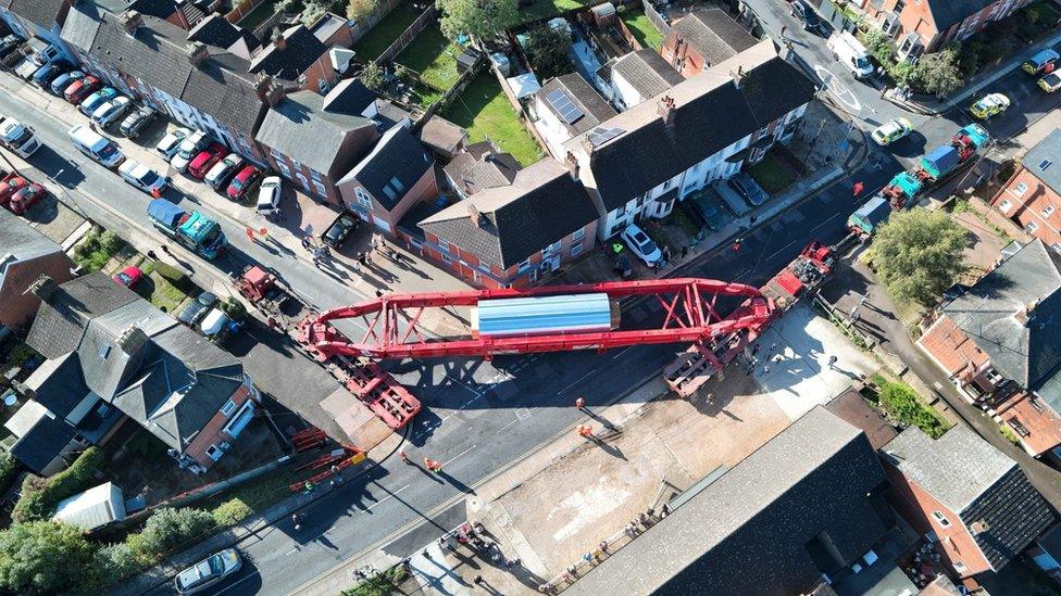 The abnormal load being moved through streets