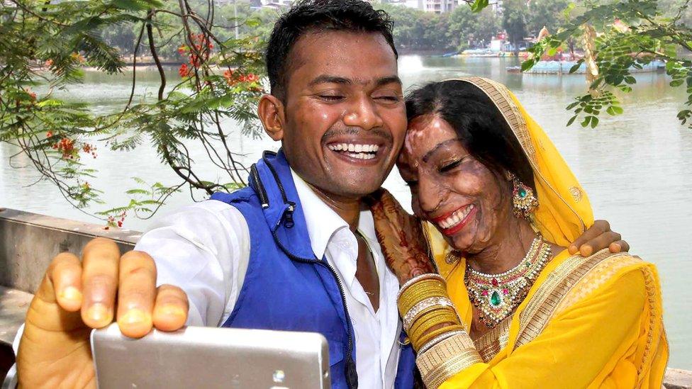 Lalita Ben Bansi in her wedding dress with groom Ravi Shankar