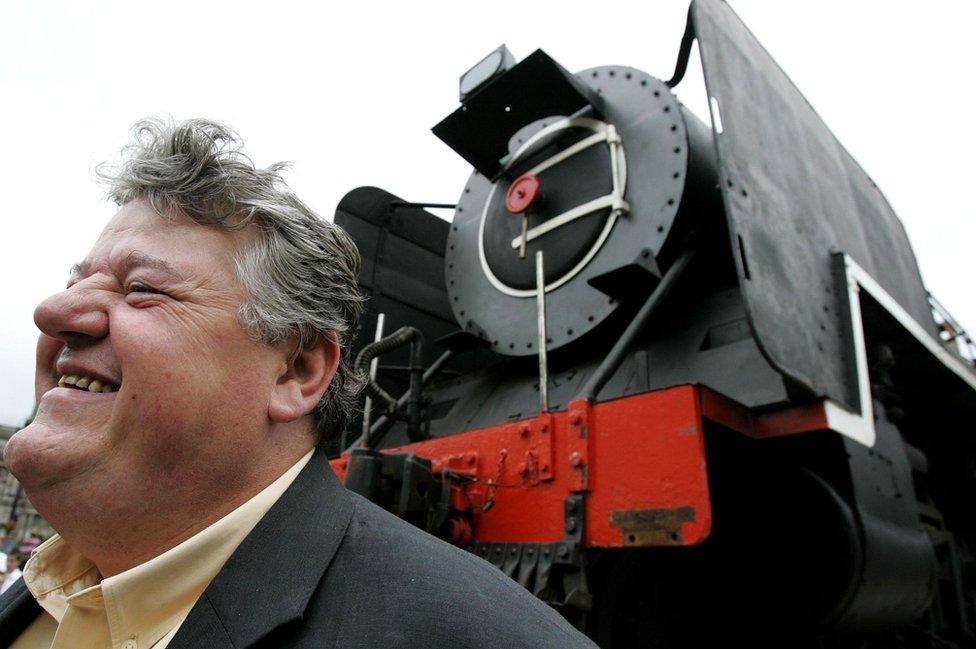 Robbie Coltrane with steam train in Glasgow