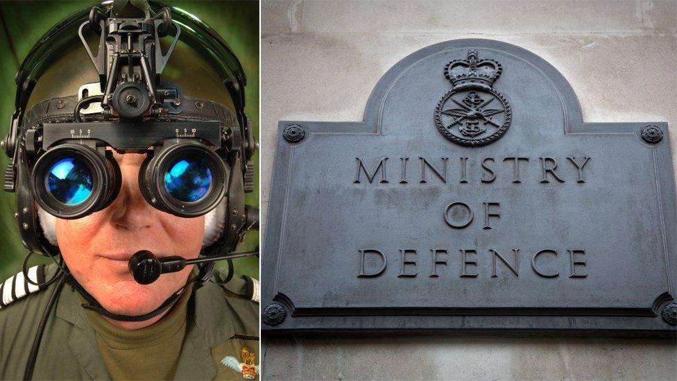 An RAF serviceman wearing night vision goggles and a MoD plaque