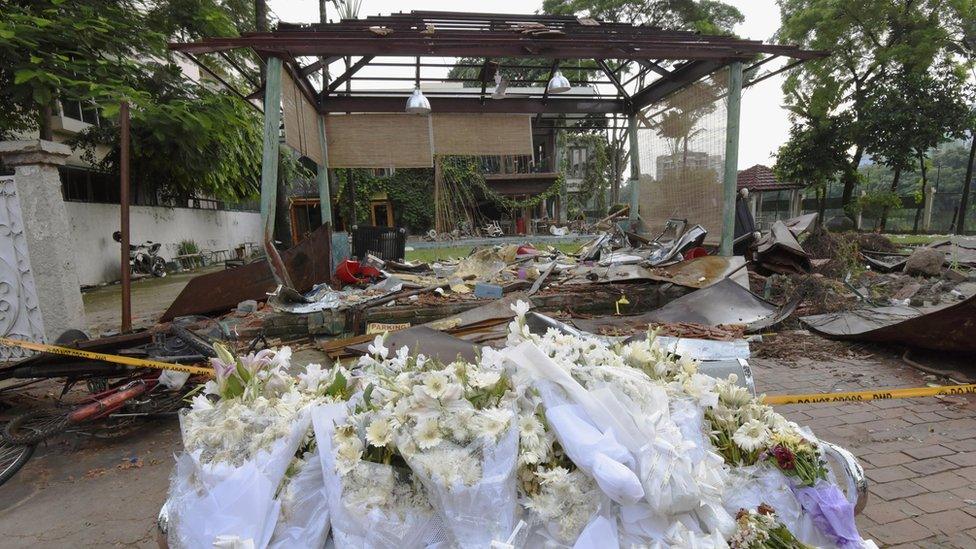 Flowers were laid at the Holey Artisan Bakery cafe in Dhaka in remembrance of the 20 hostages killed there in a terrorist in July.