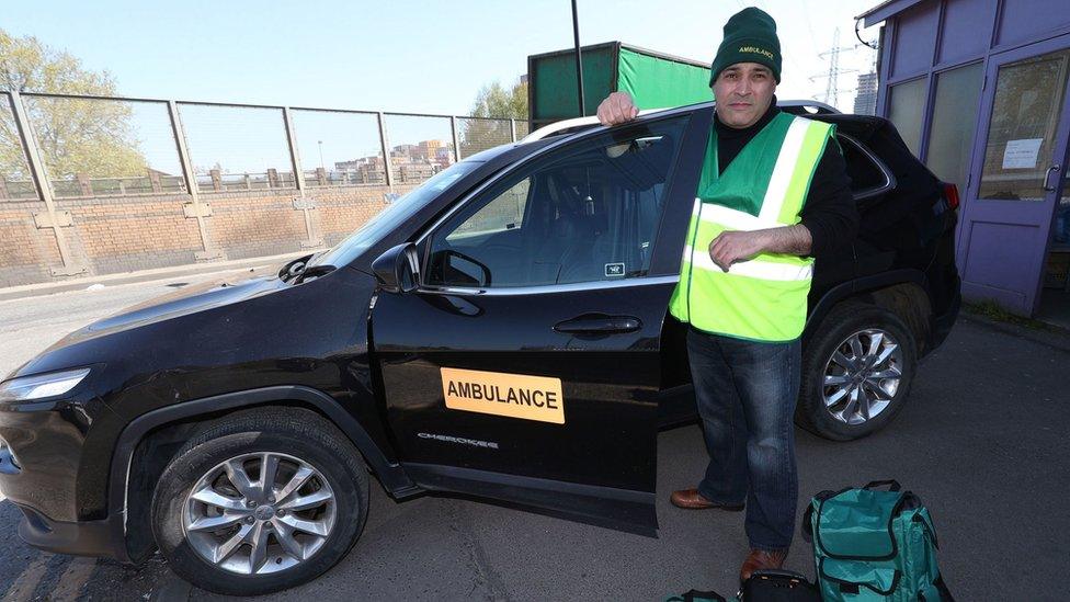 Jonathan Ganesh with the donated ambulance car