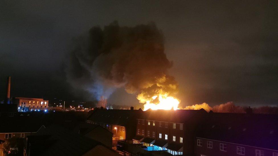 Plumes of smoke over houses