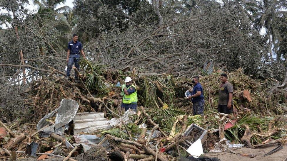 This photo taken on January 16, 2022 shows a search and rescue team in Haatafu on the western coast of Tonga's main island Tongatapu