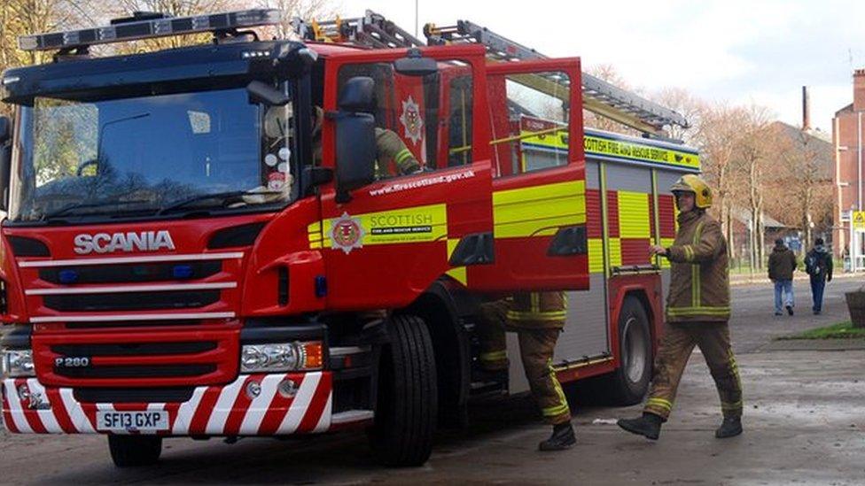 fire engine and two firefighters