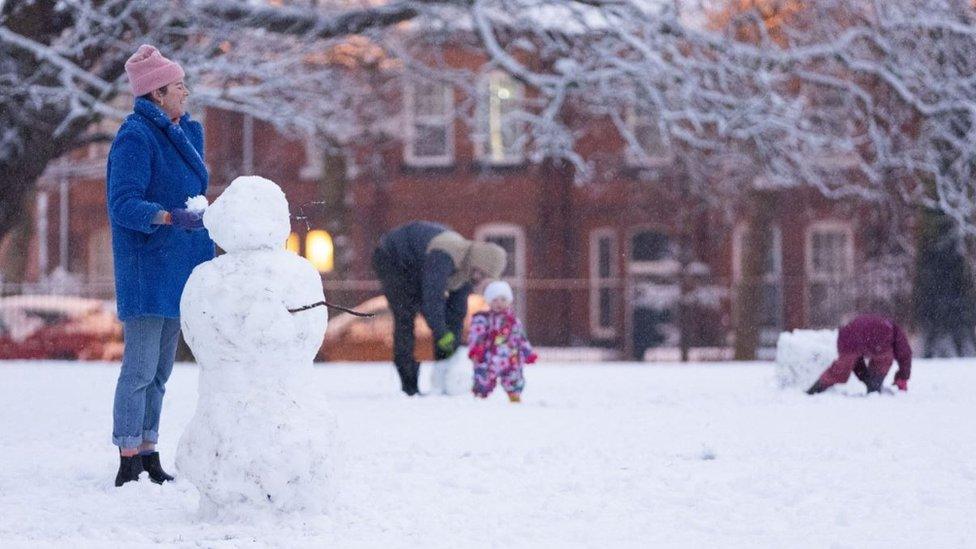 People playing in snow in Liverpool