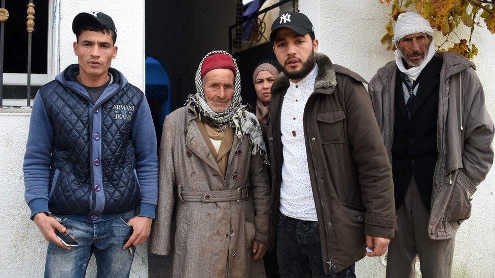 Mustapha Amri (2ndL), father of Anis Amri, next to his children Walid (L), Hanan (C), and Abdelkader and his brother (R) in front the family house in the town of Oueslatia, in Tunisias region of Kairouan on December 22, 2016